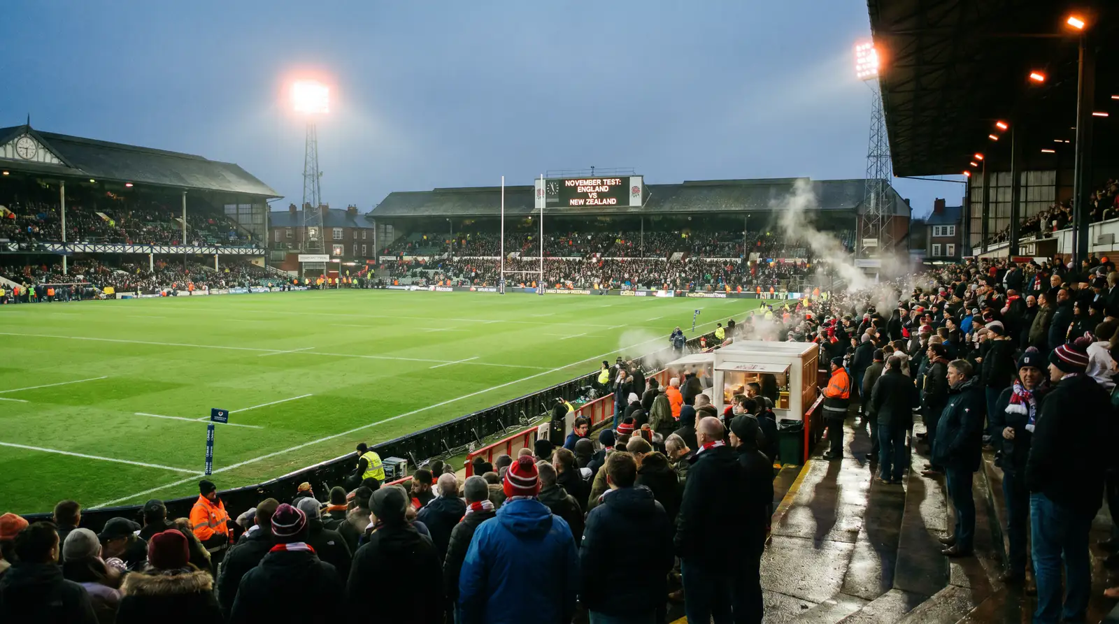 Rugby stadium at dusk before an Autumn International with floodlights warming up