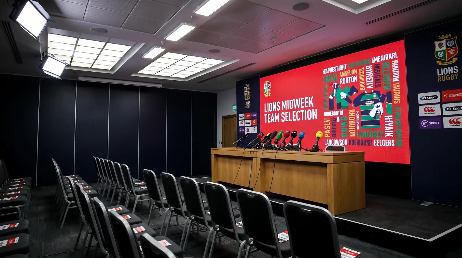 Press conference room with the Lions team for a midweek match displayed on screen