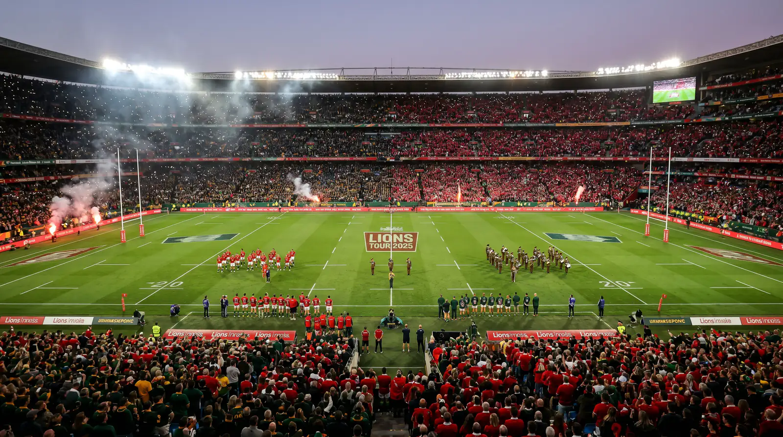 Packed stadium before a British and Irish Lions Test match with red jerseys in the crowd
