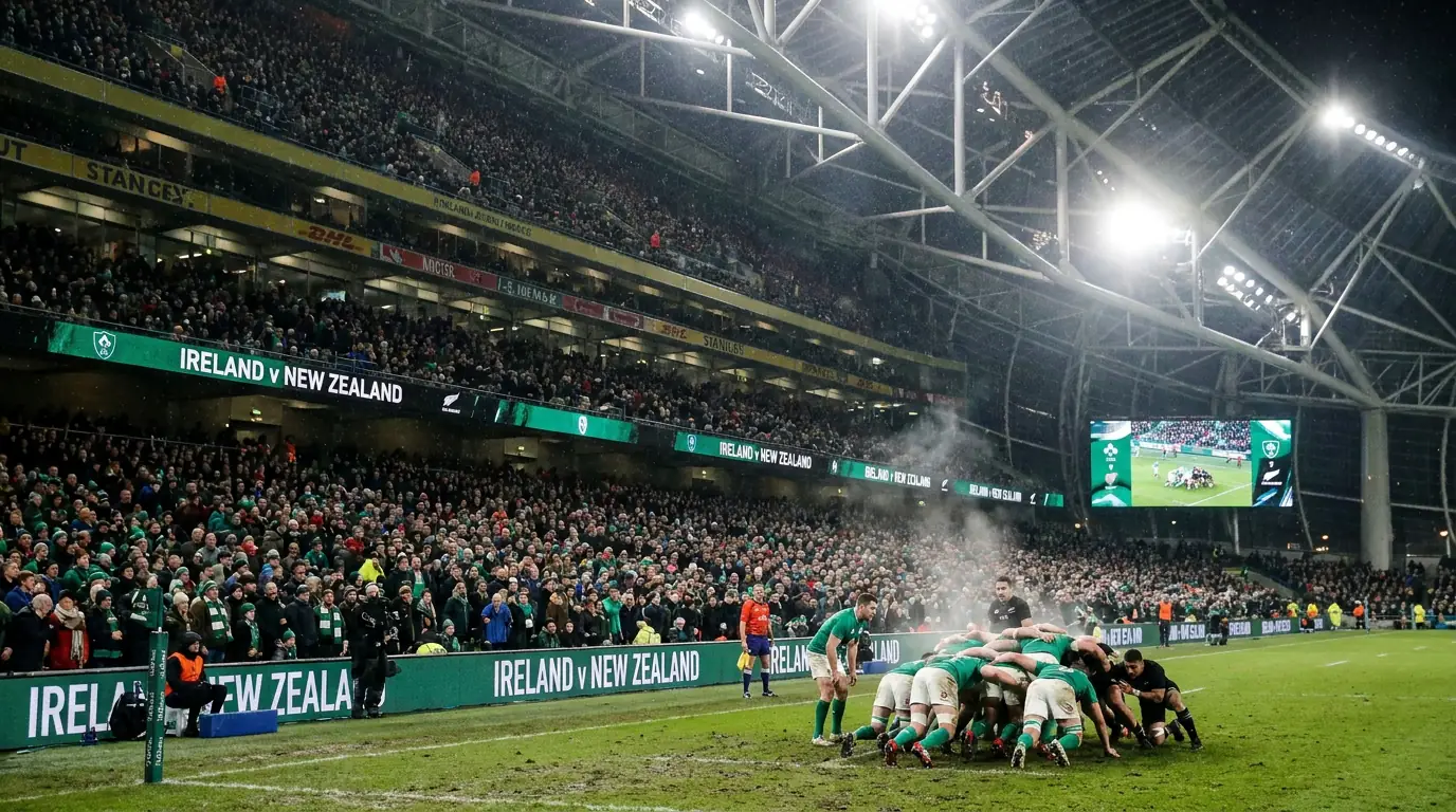 November Test match at a packed rugby stadium with fans in winter clothing