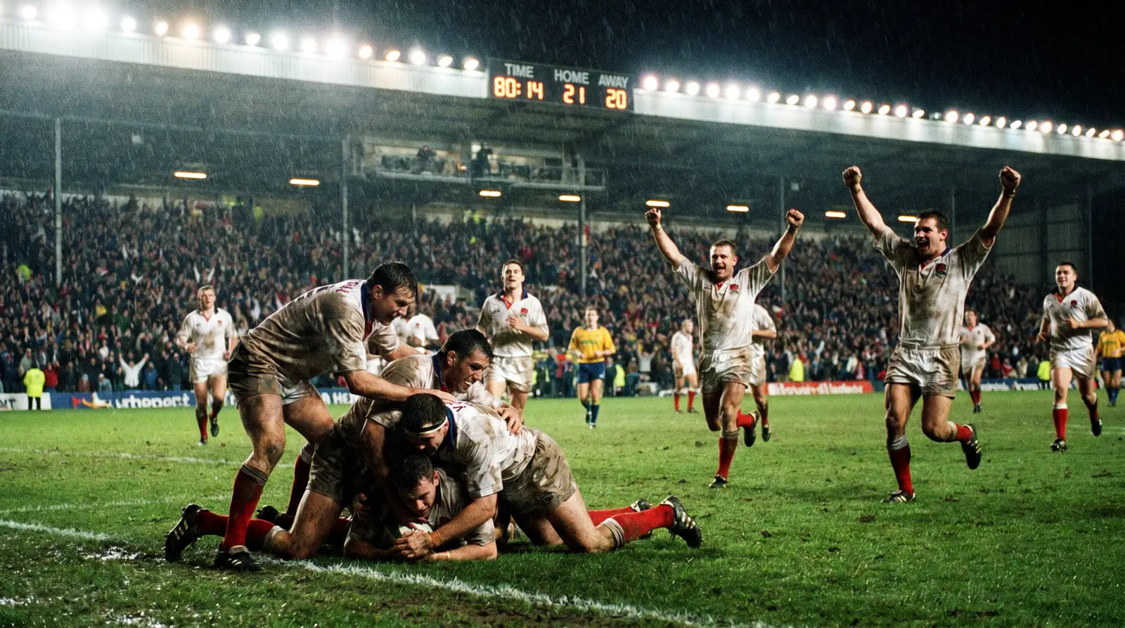 Rugby players celebrating a late try scored near full-time for a bonus point