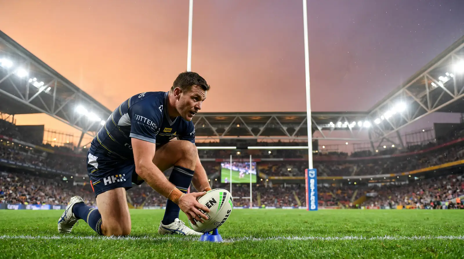 Rugby league goalkicker lining up a sideline conversion with the posts ahead