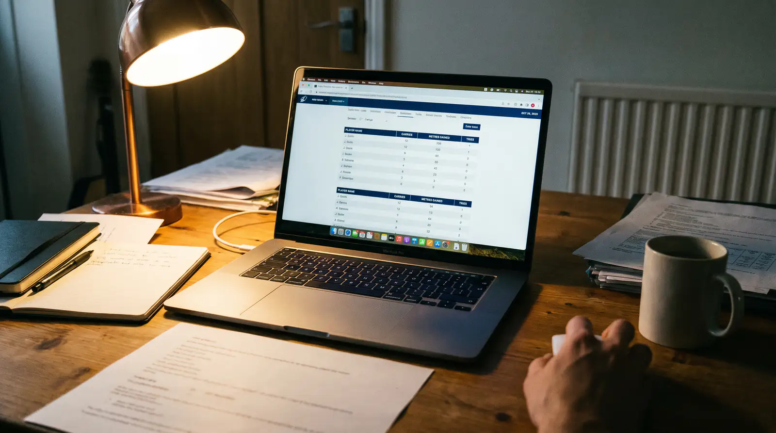Laptop showing detailed rugby match statistics with try-scoring data highlighted