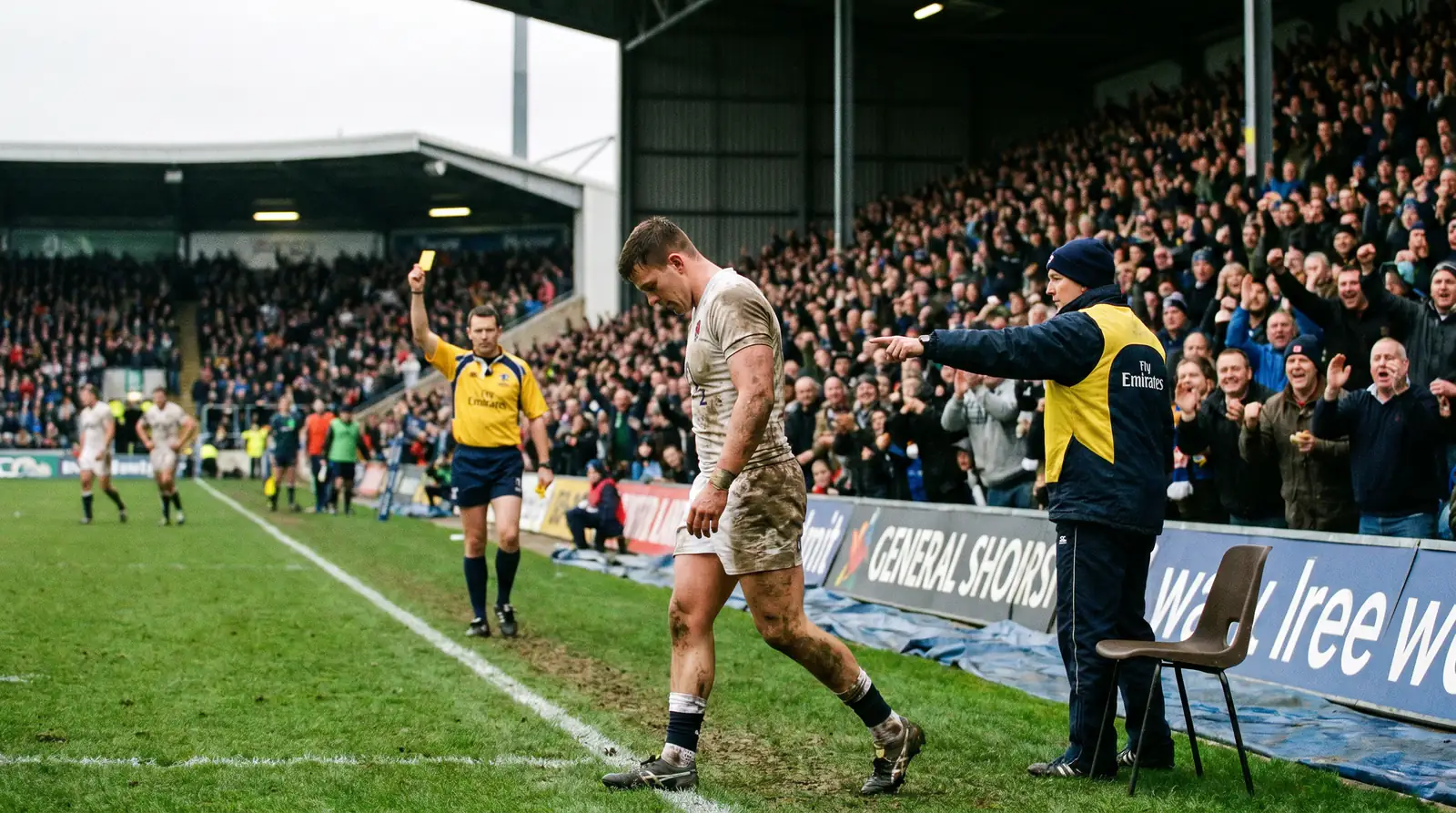 Rugby player walking to the sin bin after receiving a yellow card during a match