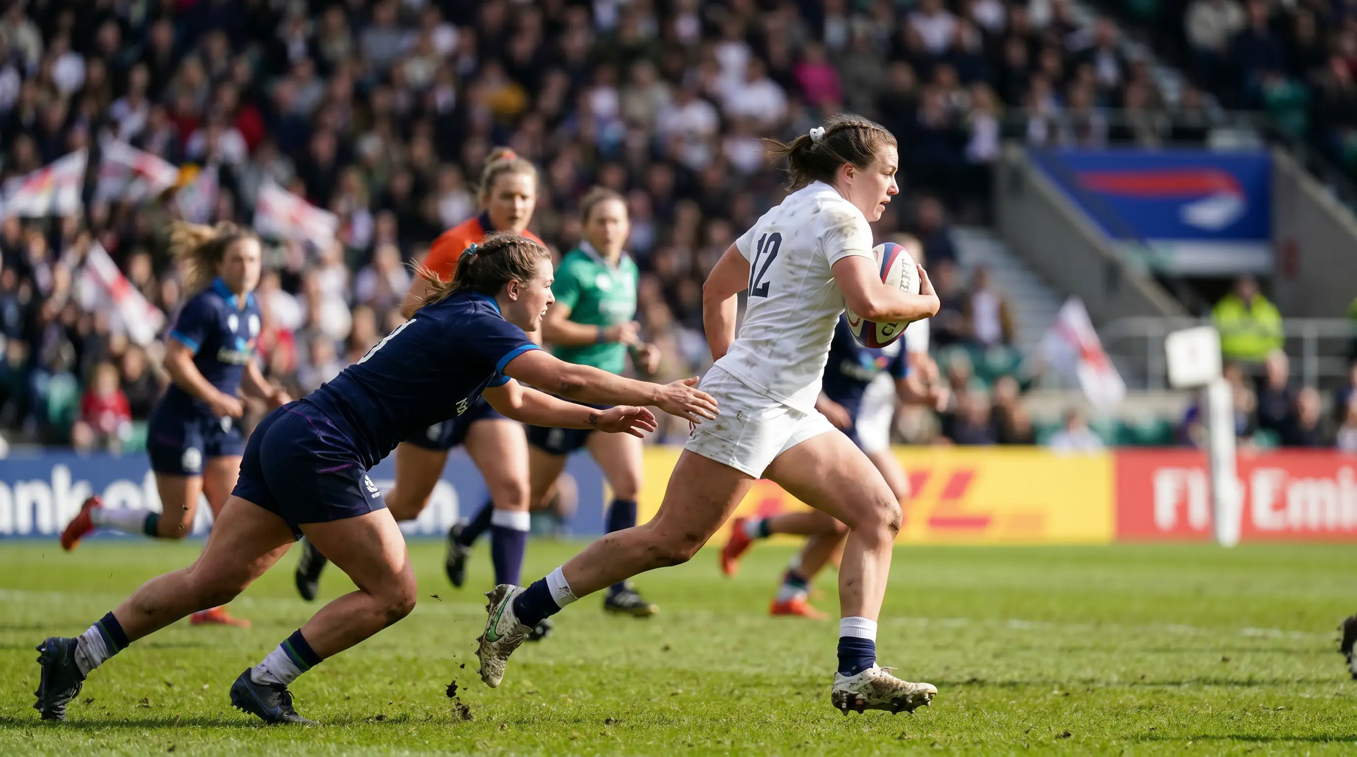 Women rugby players competing in an international match with a packed stadium
